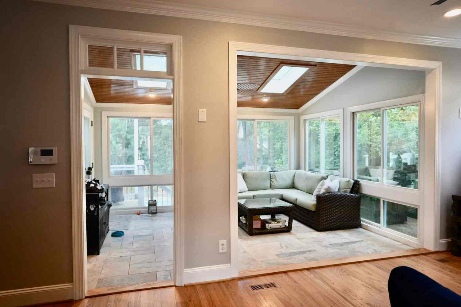 Classic sunroom addition in Raleigh with floor-to-ceiling windows and a slatted wood ceiling